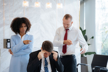 Group of international business people, teamwork, people and crisis concept - business team sitting sad and solving problems in the office.