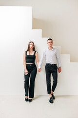 Fototapeta premium Young couple girl and boy in the studio modern lifestyle portrait. Love and relationship