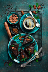 Fototapeta na wymiar Chocolate brownies plant based cake made with sweet potato. Cup of coffee. Sweets and chocolate. Top view.