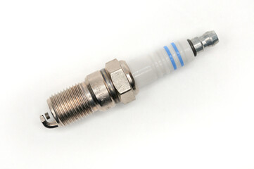 Car spark plug on isolated white background