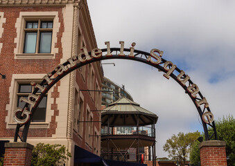 San Francisco, California, USA, June 29, 2022: The iconic arched Ghirardelli Square entrance sign. It's a famous landmark public square with shops and restaurants in the Fisherman's Wharf area.