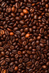 Fototapeta premium Background of roasted coffee beans. Macro photo. Free space for text. Top view.
