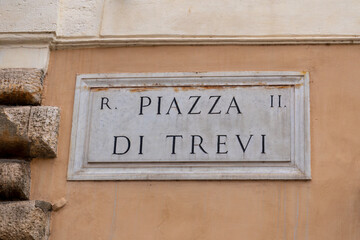 Street sign of the famous piazza di trevi in rome, italy