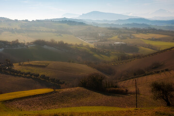 Countryside landscape in autumn, agricultural fields among hills