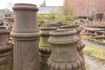 Fototapeta na wymiar Chimney pots in a salvage yard