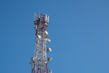 Telecommunications tower with a clear blue sky background