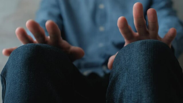 Hands of a worried man before an interview or exam, close-up