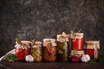 Pickled vegetables in glass jars.