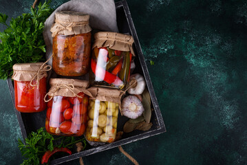 Pickled vegetables in glass jars.