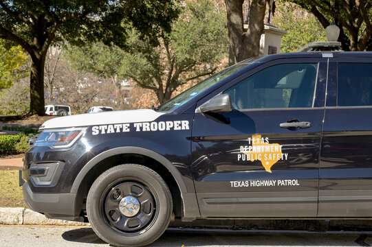 Austin, Texas, USA - February 2023: State Trooper police patrol car of the Texas Highway Patrol parked on a street in the city centre