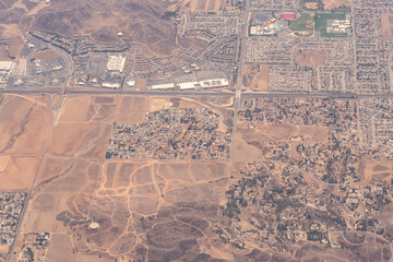 Aerial view of planned communities, construction, highways and subdivisions in the desert outside of Los Angeles in Southern California