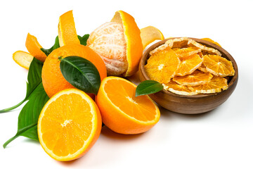 Dry orange slices and fresh fruits on white background. Dehydrated snacks of orange fruits. Healthy, no sugar sweet food. Candied citrus fruit