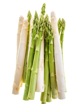 Fresh white and green asparagus tips isolated on white background. Top view photography of spring vegetables. Background for haelthy nutrion. 