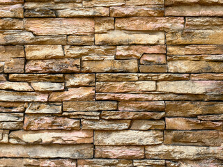 Wall made of decorative stones background texture