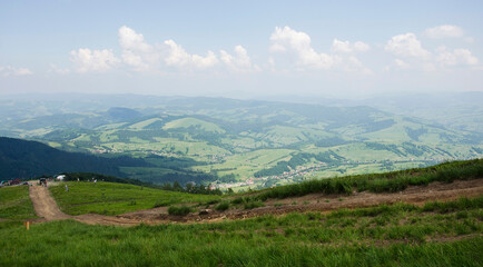 Naklejka premium View of green hills and mountains, Ukrainian Carpathians, summer landscape of mountains