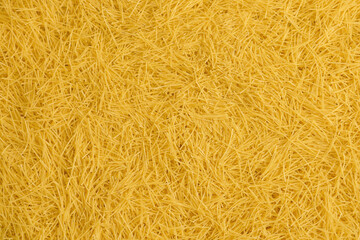 Italian raw pasta filini vermicelli from durum wheat. Food and ingredientes background.