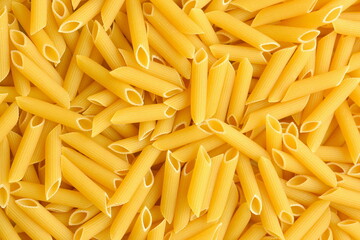 Raw penne pasta background