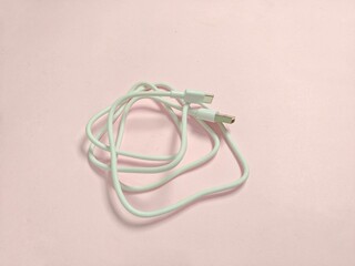 lightning cable for iPhone isolated on a bright  pink background