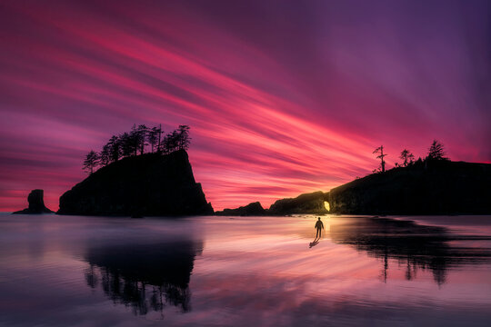 Last lights at sunset of La Push Beach with Second Beach's gate in the background and sand textures on the foreground, Olympic National Park, Washington, USA