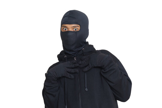 Mysterious Thief Man Wearing Black Hoodie And Mask Was Caught While Sneaking Around. Shocked And Frightened Criminal. Isolated Image On Gray Background