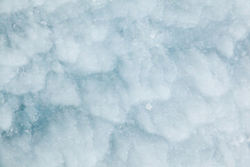 Frozen, uneven, icy texture, close-up. Rough ice.