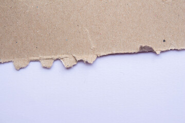 Ripped cardboard paper piece on a isolated white background