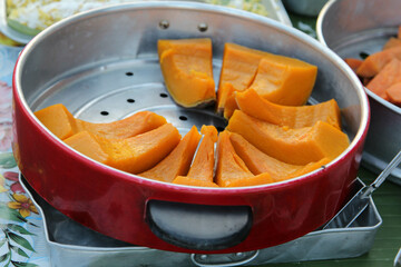 Healthy Food, Steamed pumpkin slices in steamer ready for sale in the market