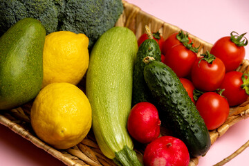 fresh vegetables on the table. Vegetables in a basket. Wicker basket with assorted raw organic vegetables in the garden.