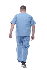 Fototapeta premium rear view. a male medic confidently striding forward .