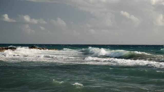 Waves breaking on rocks in Mediterranean Sea