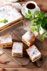 Clasic sponge cake with apples on table, selective focus. Homemade cake