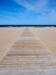 Boardwalk in the Mediterranean in the beach of Gandia, capital of the county of La Safor. Valencia, Spain