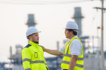 Group Asian man petrochemical engineer working at oil and gas refinery plant industry factory,The people worker man engineer work control at power plant energy industry manufacturing