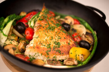 Kalkan fish in a frying pan.