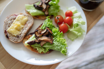 Healthy western breakfast, Sandwich on sourdough bread with cheese, mushroom and vegetable. Picnic breakfast