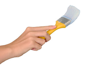 A woman's hand paints the wall with a brush in white, isolated on a white background. Lifestyle repairs in the new apartment