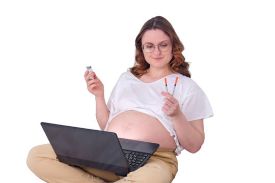 Pregnant woman on home bed with laptop looks at syringe and ampoule with vaccine, isolated on a white background - Powered by Adobe
