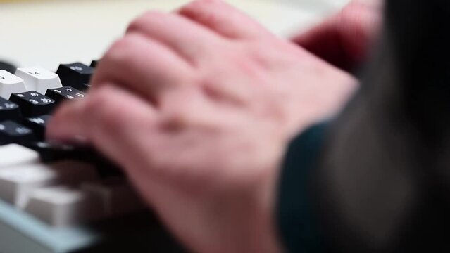 Typing on a mechanical keyboard close up