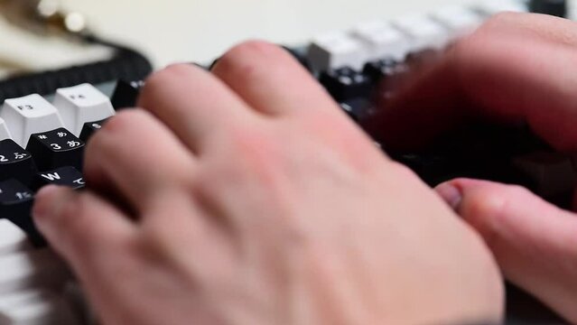 Typing on a mechanical keyboard close up