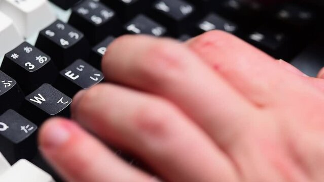 Typing on a mechanical keyboard close up