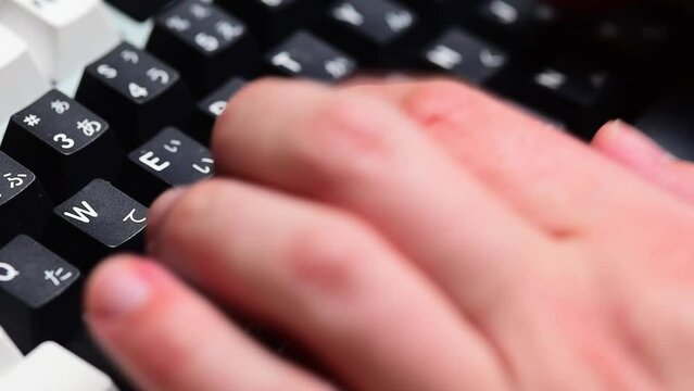 Typing on a mechanical keyboard close up
