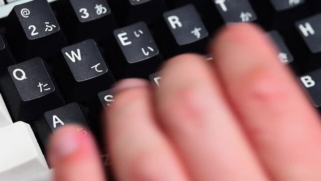 Typing on a mechanical keyboard close up