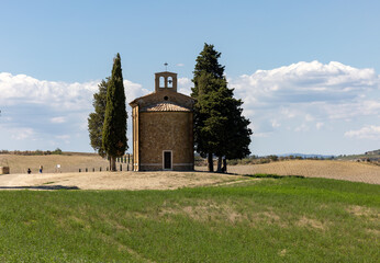 Fototapeta na wymiar Capella Di Vitaleta in countryside between San Quirico and Pienza in Val d Orcia Tuscany. Italy