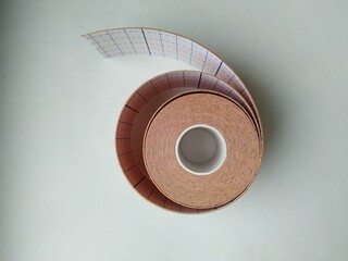 kinesiology tape on white background. Physiotherapy and therapeutic tape for wrist pain, aches and tension. elastic therapeutic tape. adhesive tape and alternative medicine

