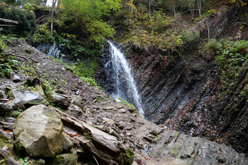 Little waterfall and geological mountain folds in the mountains - obrazy, fototapety, plakaty