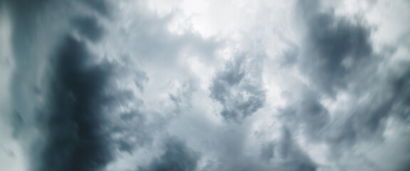 Dramatic cloudscape texture. Dark heavy thunderstorm clouds before rain. Overcast rainy bad weather. Storm warning. Natural gray background of cumulonimbus. Nature backdrop of stormy cloudy sky.
