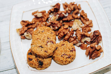 Healthy breakfast oat granola with nuts on a plate.