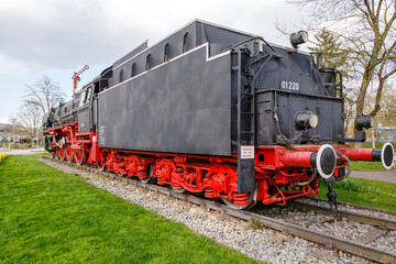 Steam locomotive in Treuchtlingen. The express locomotive 01 220 as a monument in Treuchtlingen. The locomotive is registered as a monument in the Bavarian monument list.