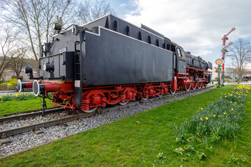 Fototapeta na wymiar Steam locomotive in Treuchtlingen. The express locomotive 01 220 as a monument in Treuchtlingen. The locomotive is registered as a monument in the Bavarian monument list.