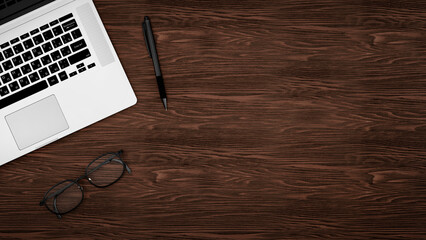 office table and computer concept, background top view with office supplies, wooden table with offise supplies and notes, place for text and design.